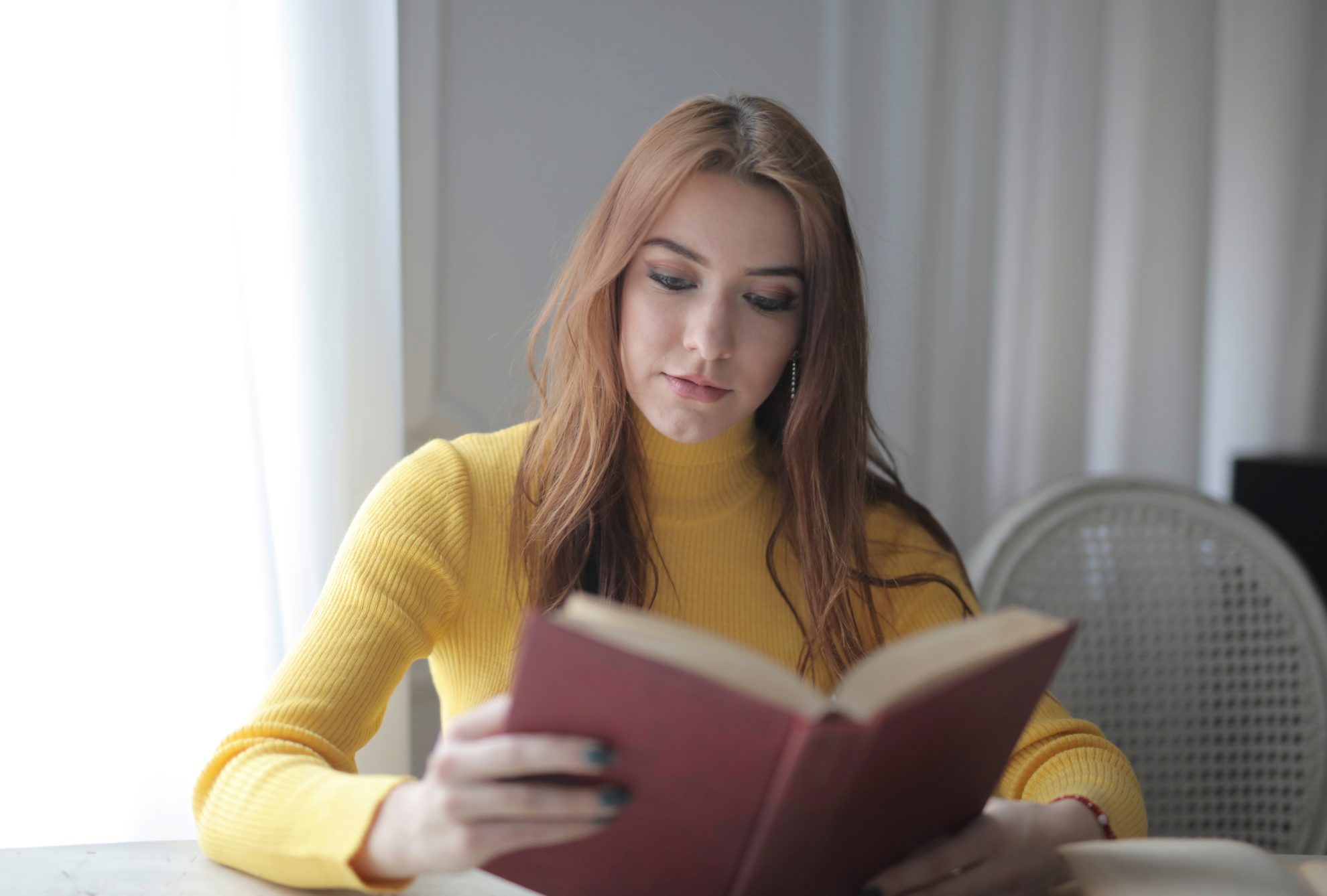 a girl reading a career advice book